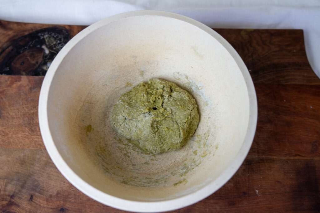 Nettles pasta dough mixed in mixing bowl.