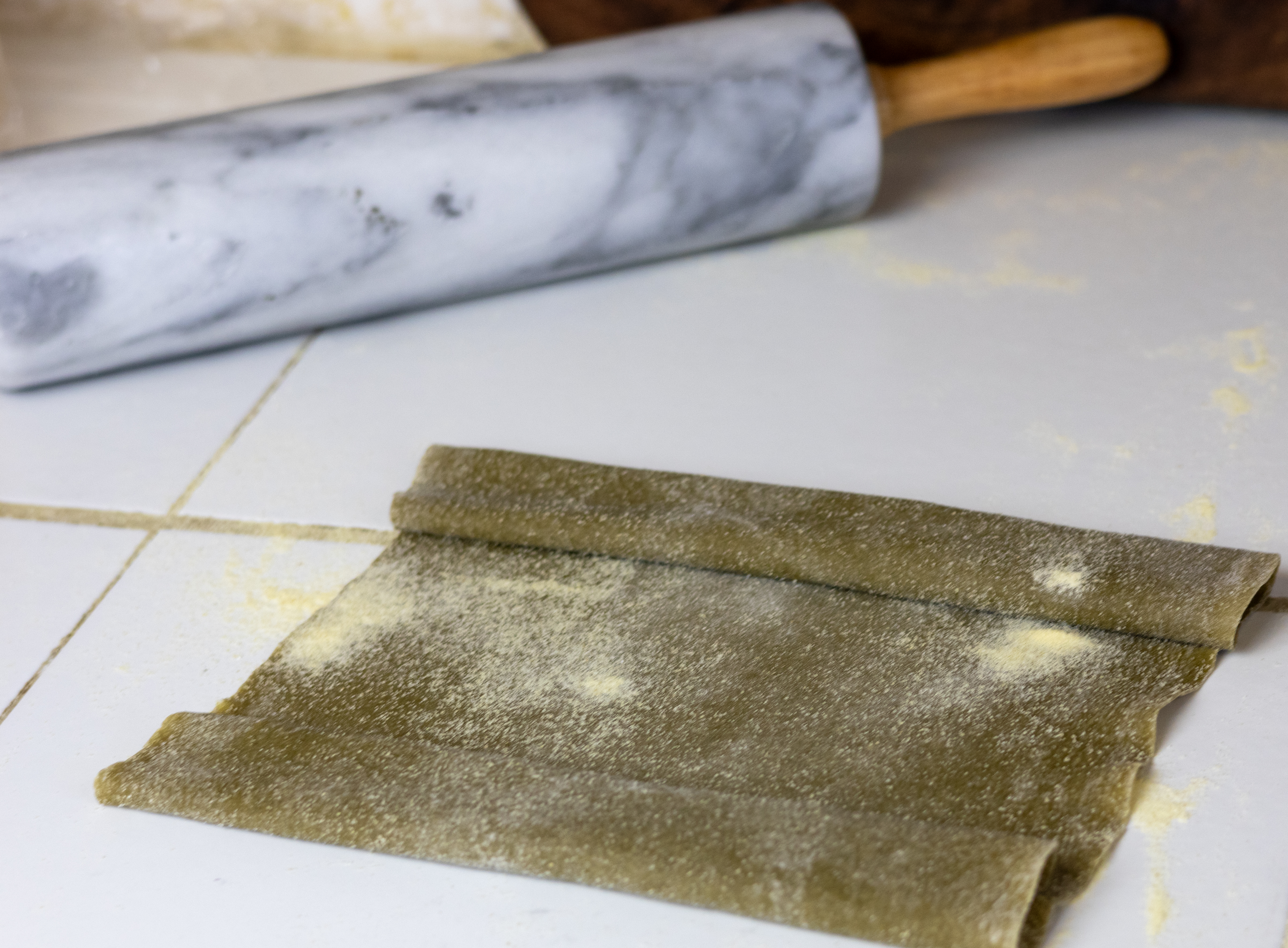 Nettles dough rolled up and ready to cut for pasta.