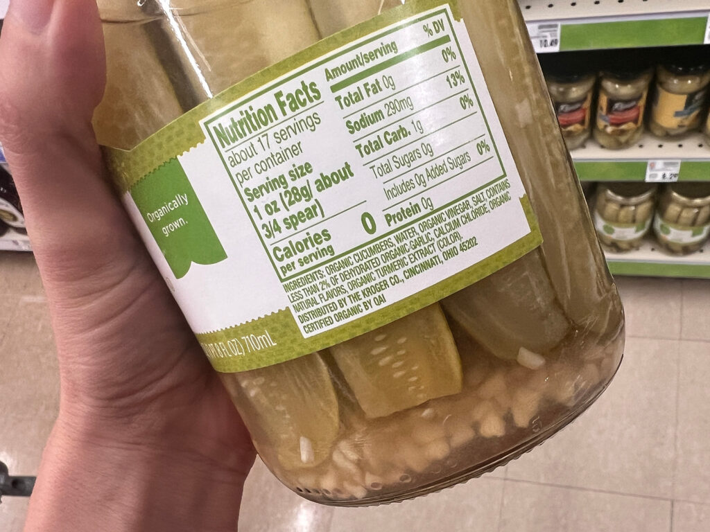 A jar of pickles illustrating the difference between pickling fermenting.