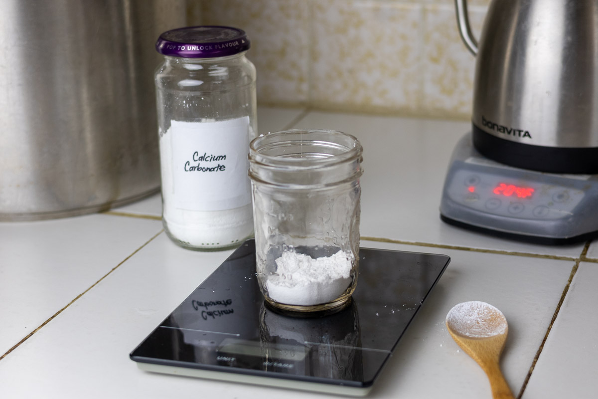 Calcium carbonate being measured out next a hot water kettle.
