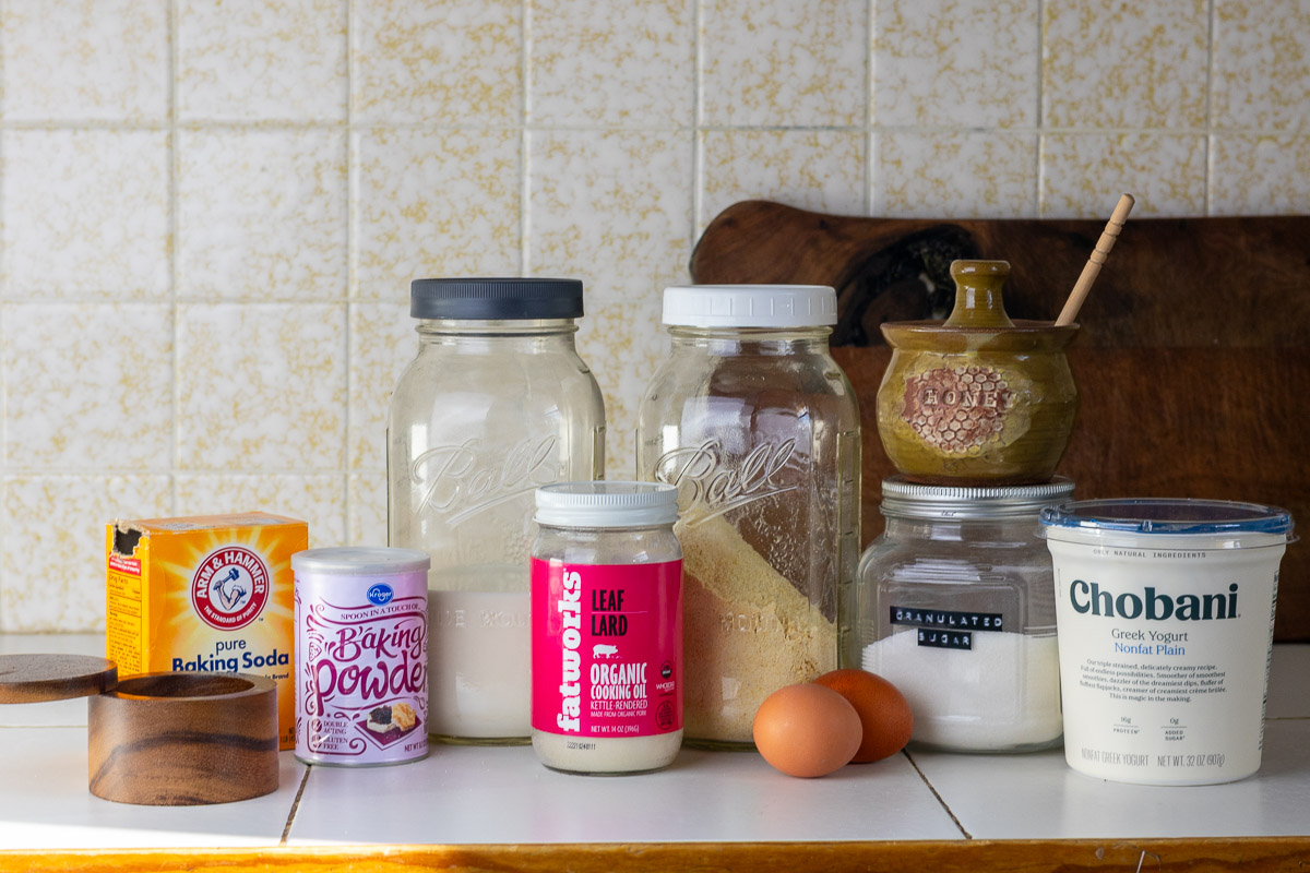 Ingredients laid out on a kitchen counter for gluten-free cornbread.