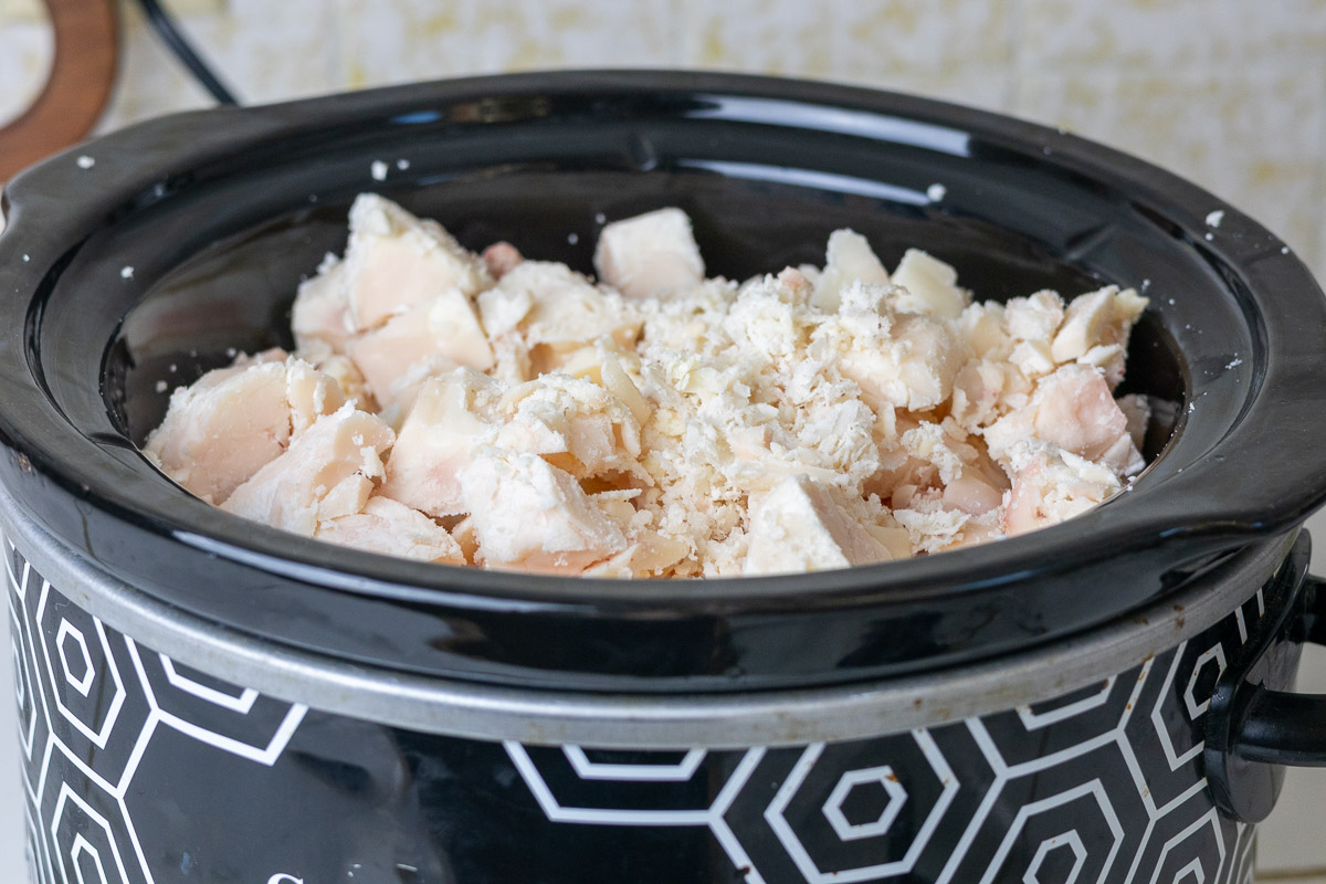 Suet chunks in crockpot ready to dry render into tallow.