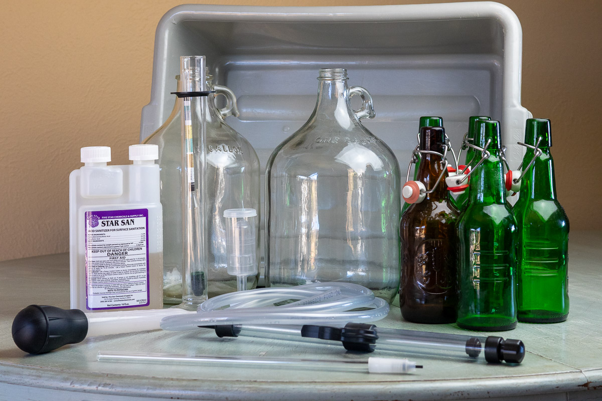 equipment necessary to make and bottle 1 gallon of mead on a table.